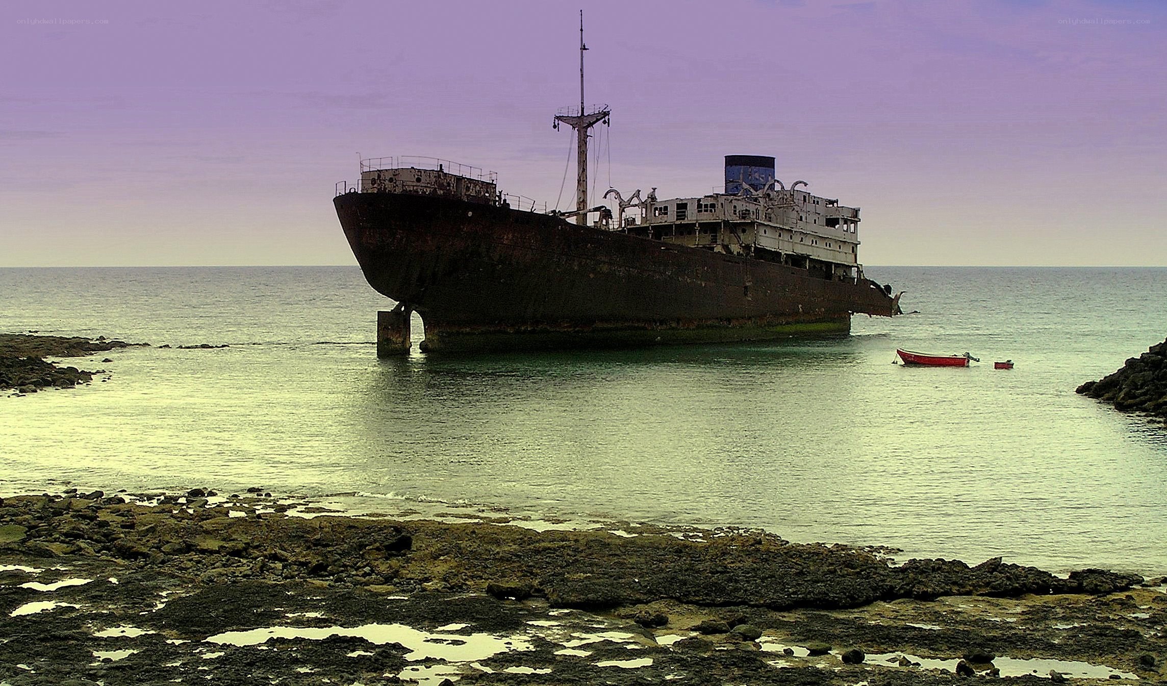 Abandoned shipwreck on shore