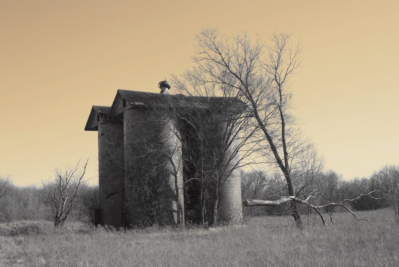 Abandoned Silo in Field