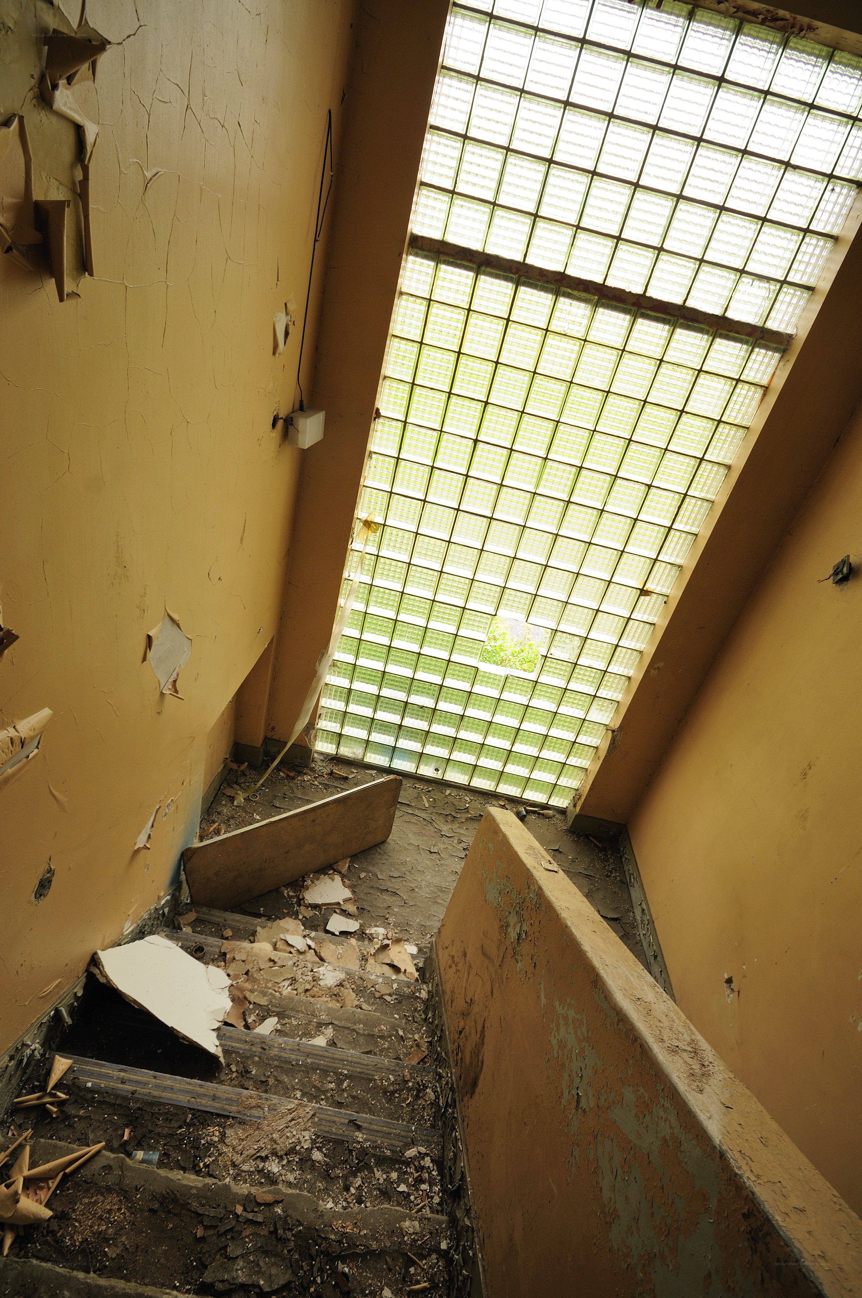 Abandoned stairwell with glass block ceiling