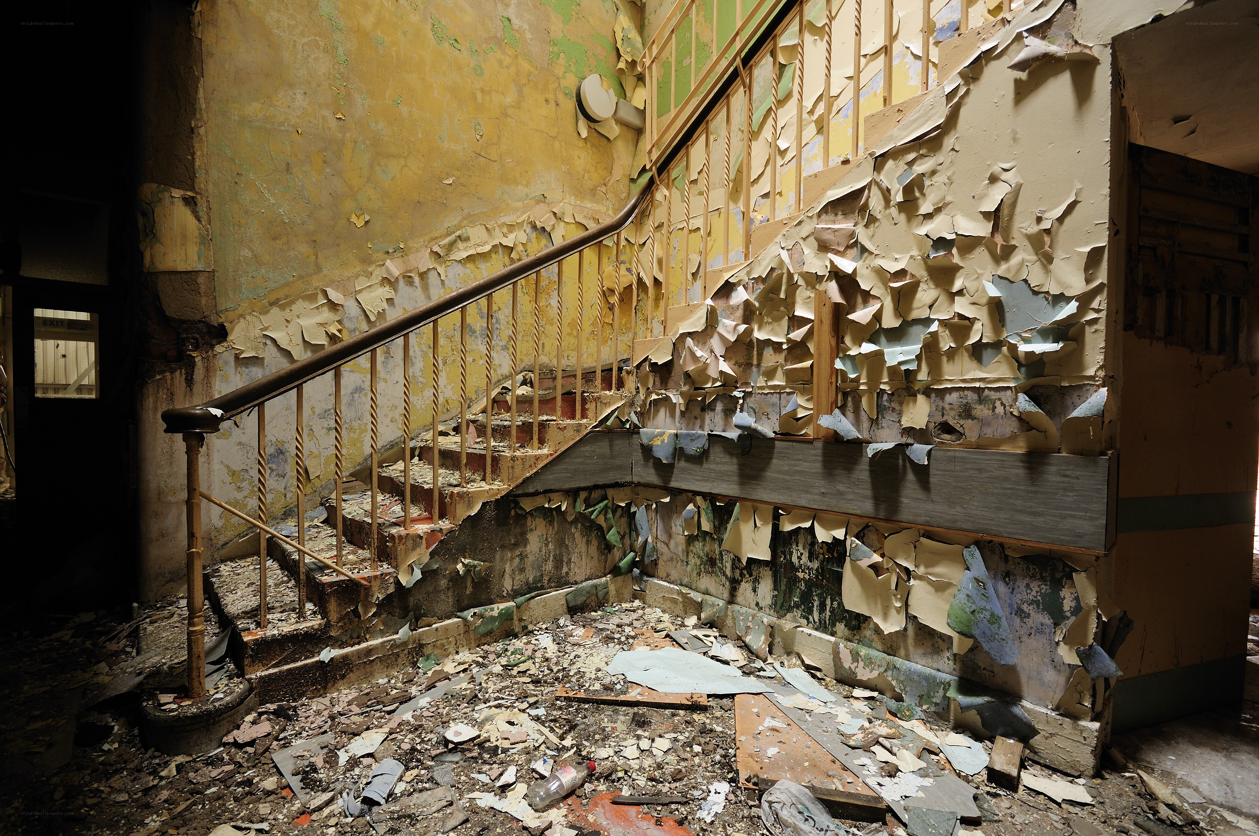 Abandoned stairwell with peeling paint