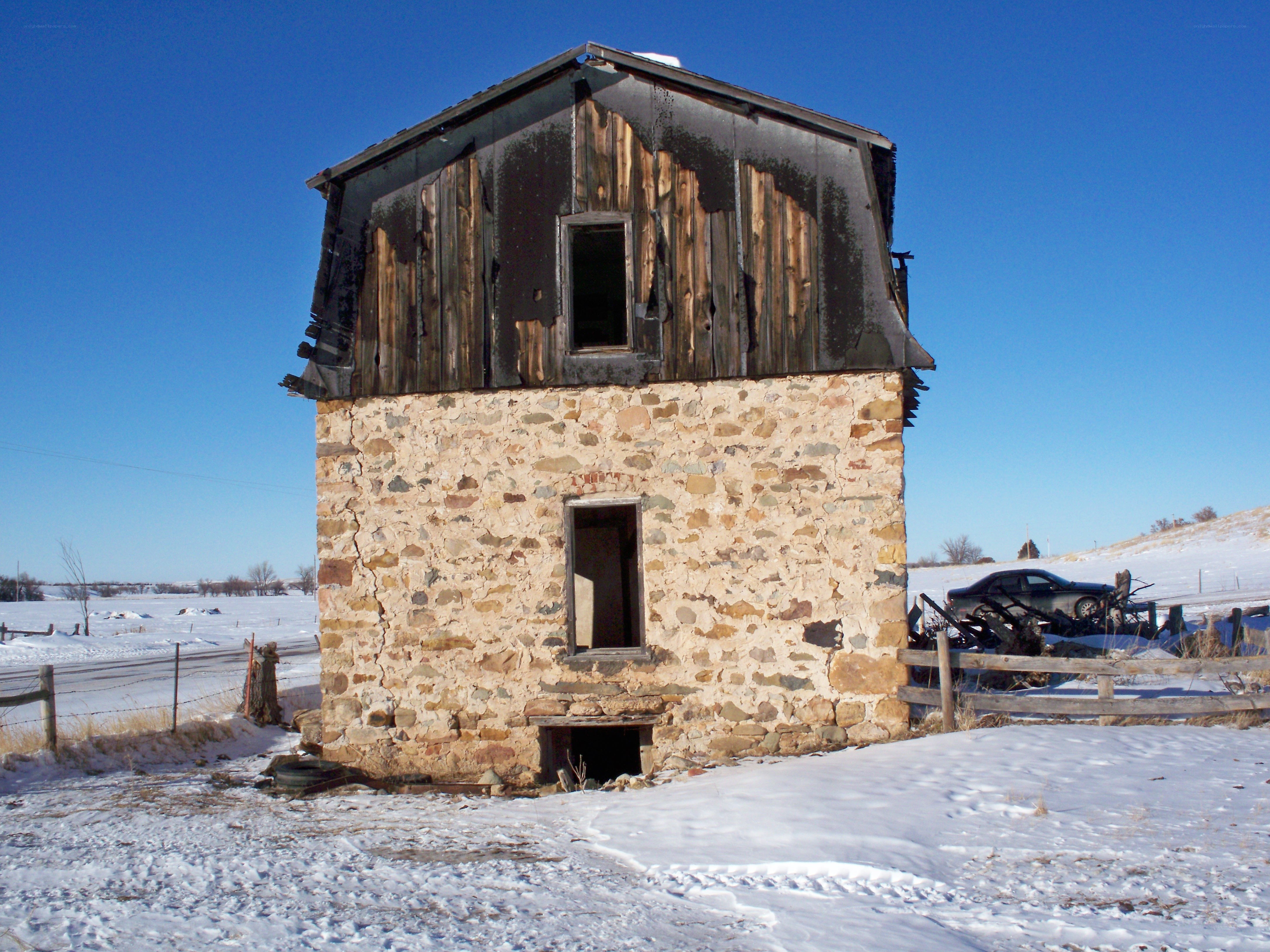 Abandoned stone building in winter