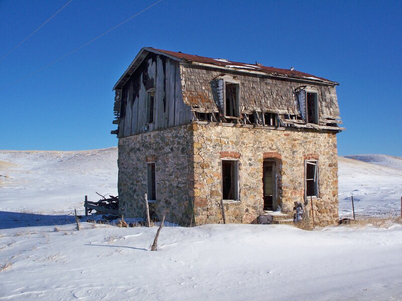 Abandoned stone house in winter