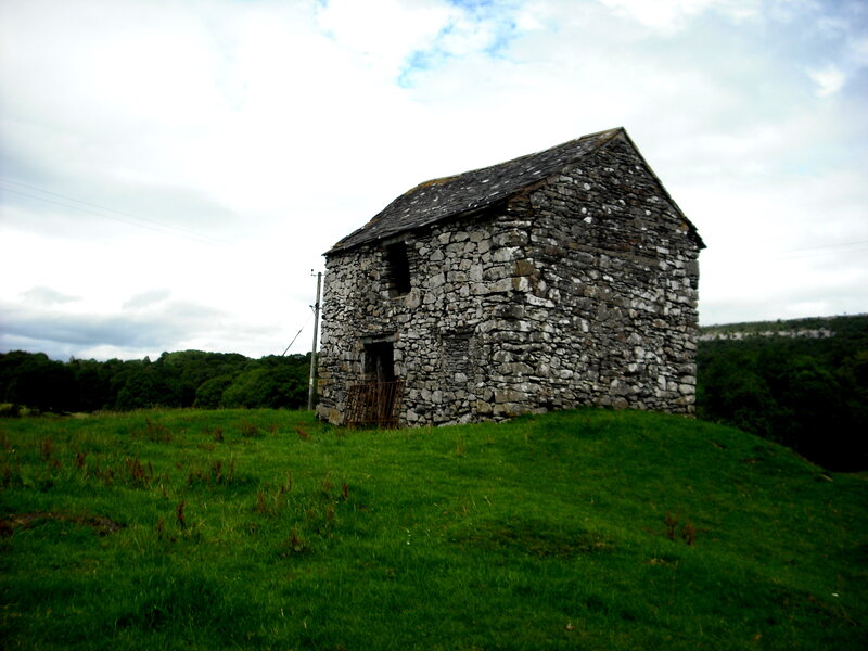 Abandoned stone hut in a field