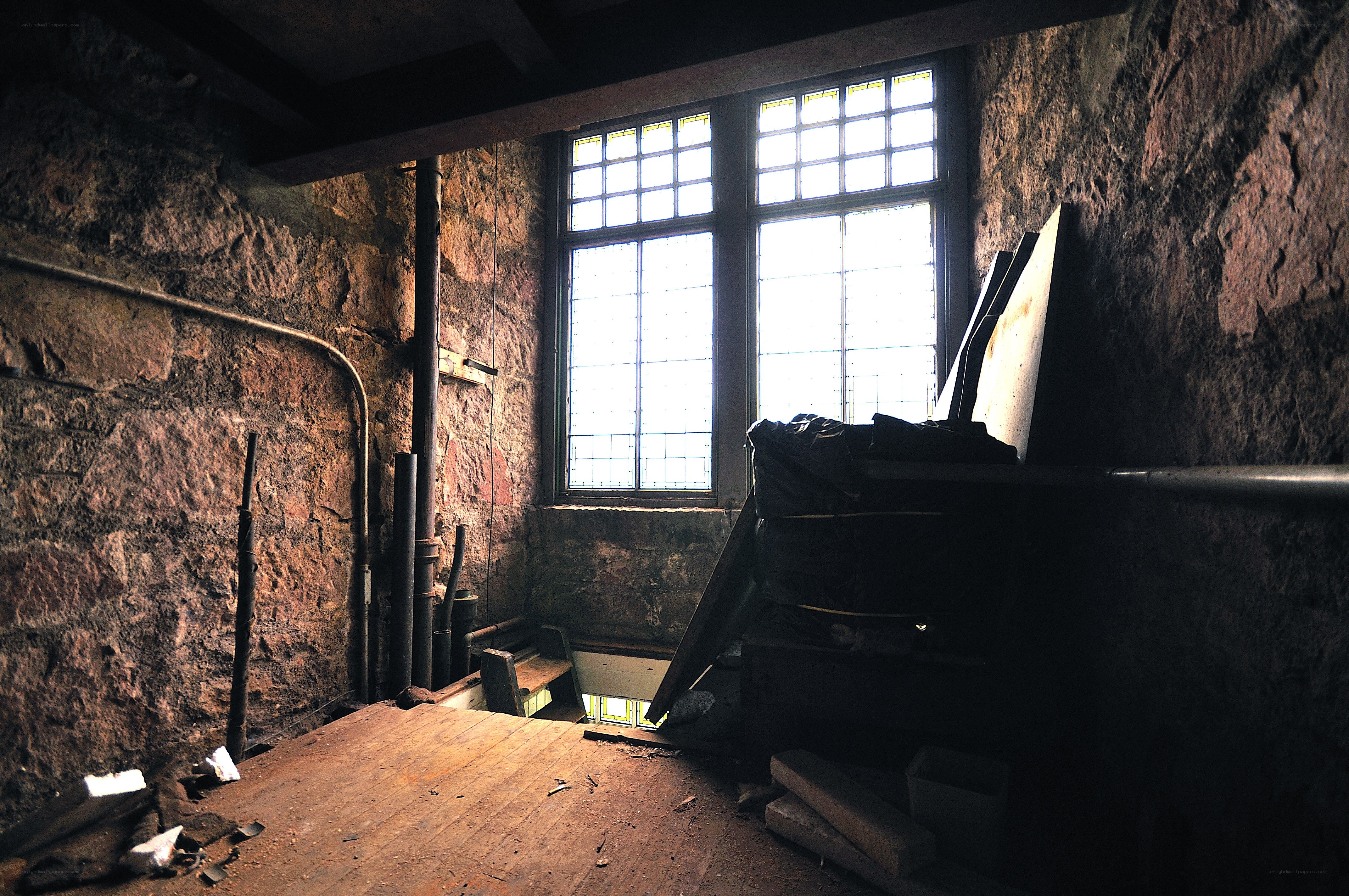 abandoned stone room with windows