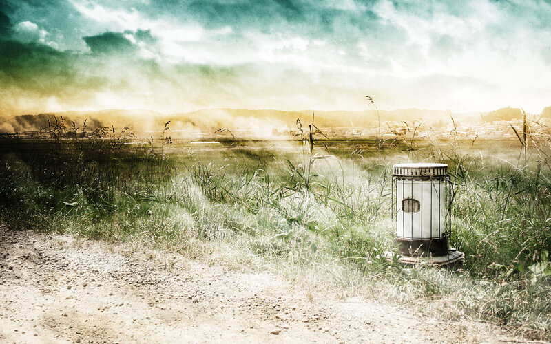 Abandoned stove in a foggy field