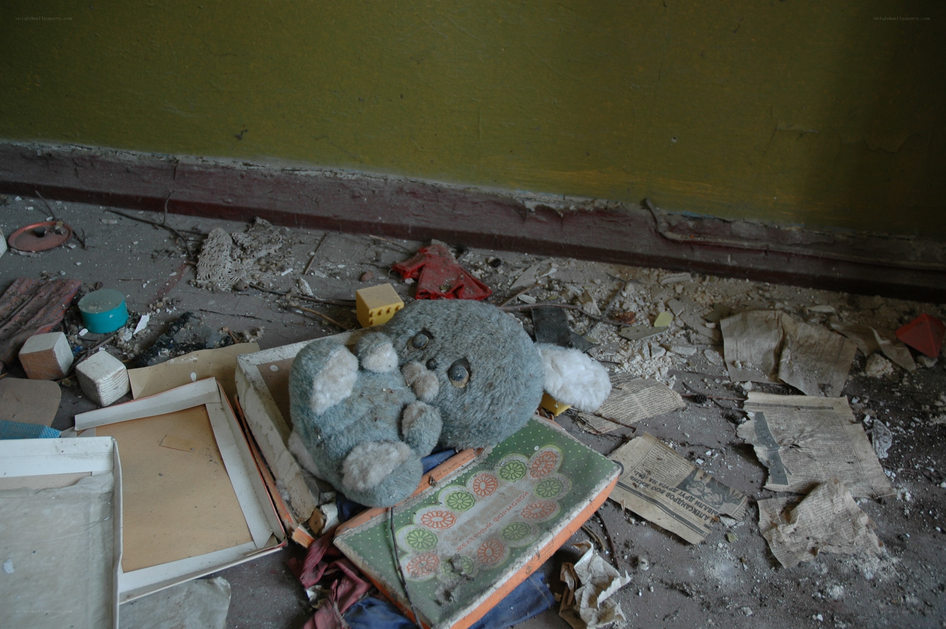 Abandoned stuffed toy in debris