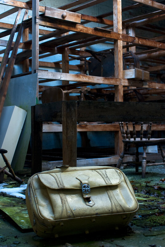 abandoned suitcase in storage room