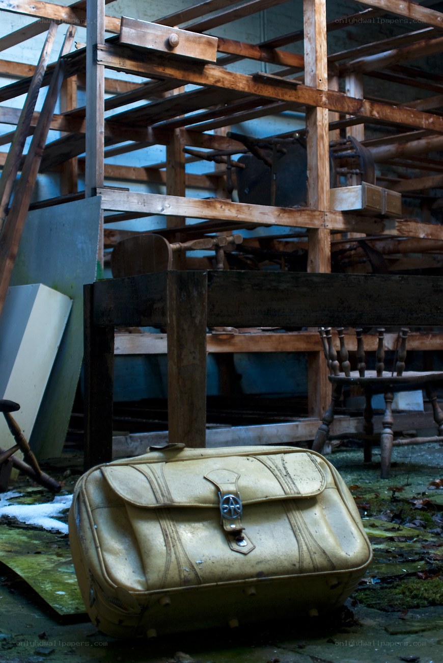 abandoned suitcase in storage room