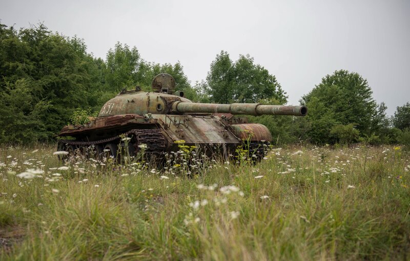 Abandoned Tank in Field — Green, Desolate