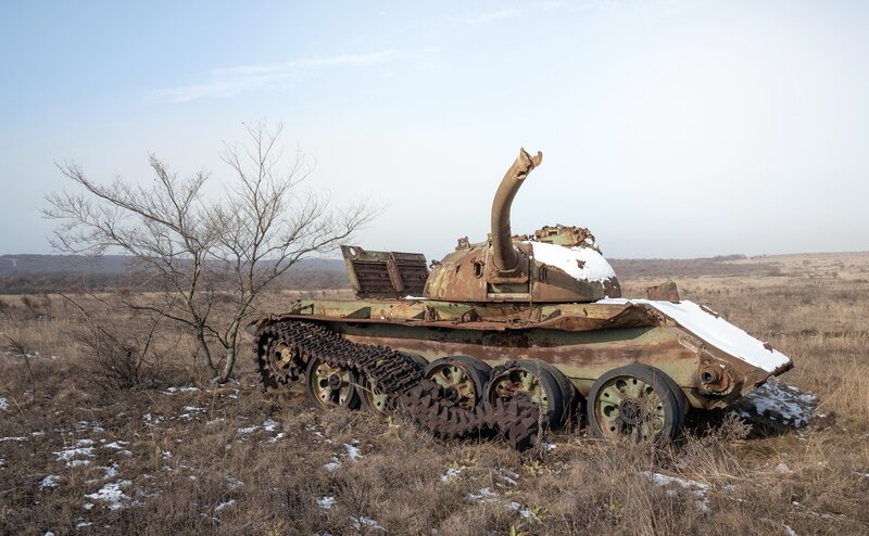 Abandoned Tank in Field — Green, Desolate, Winter