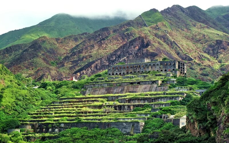 Abandoned terraced buildings on a hillside