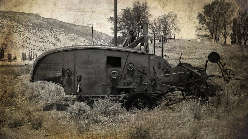 Abandoned tractor in a field