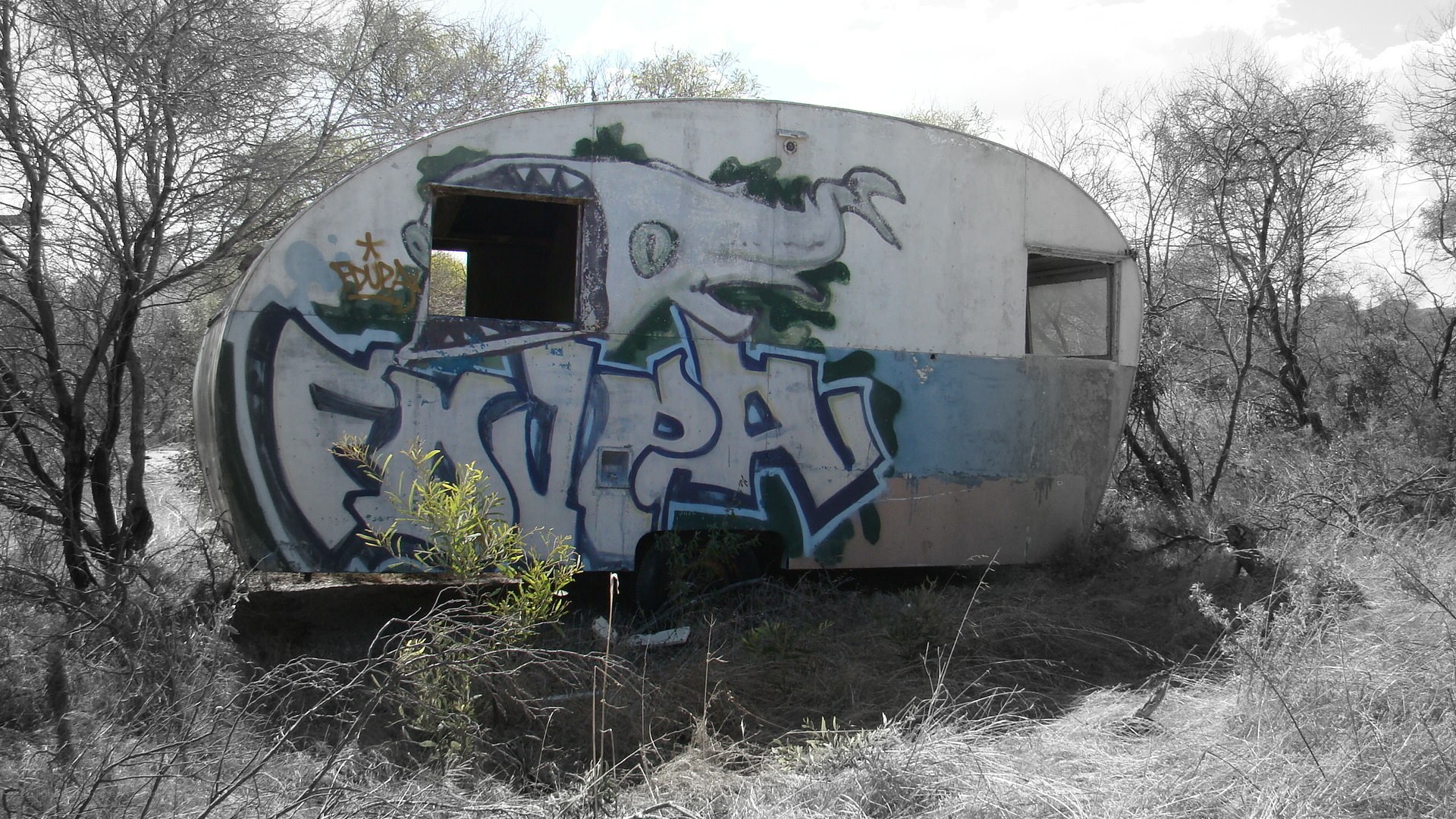 abandoned trailer with graffiti