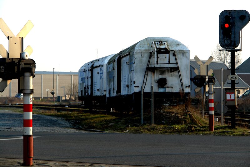 abandoned train at a railway crossing