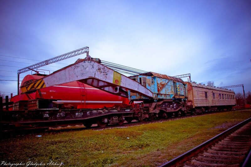 Abandoned train cars at dusk