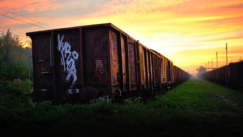 Abandoned Train Cars — Orange, Dramatic