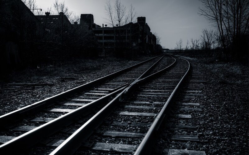 Abandoned train tracks at dusk
