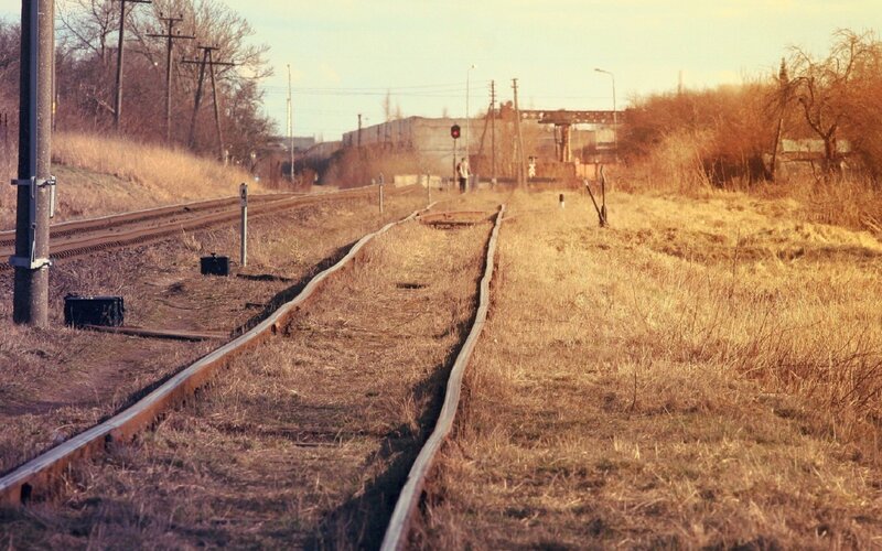 abandoned train tracks at dusk