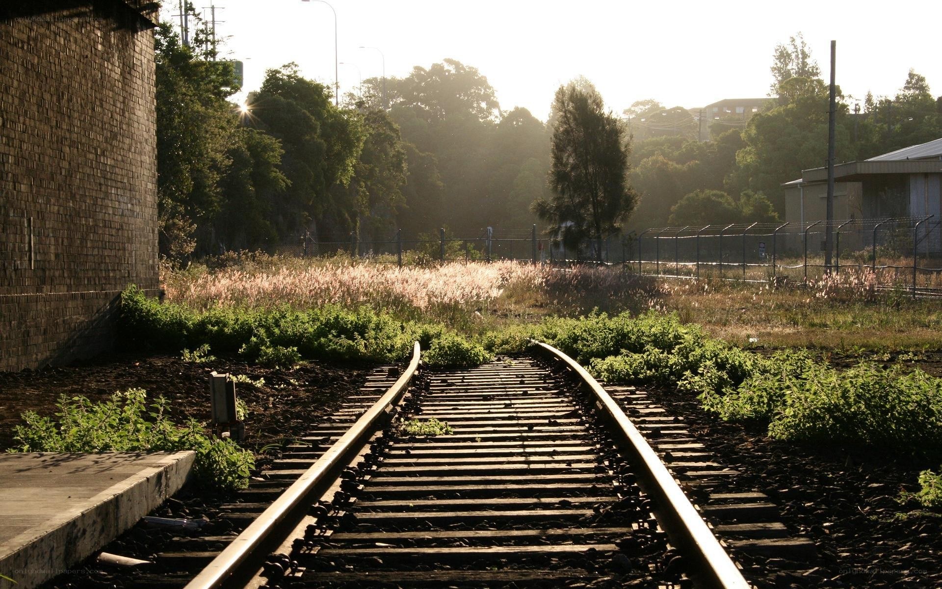 abandoned train tracks at sunrise