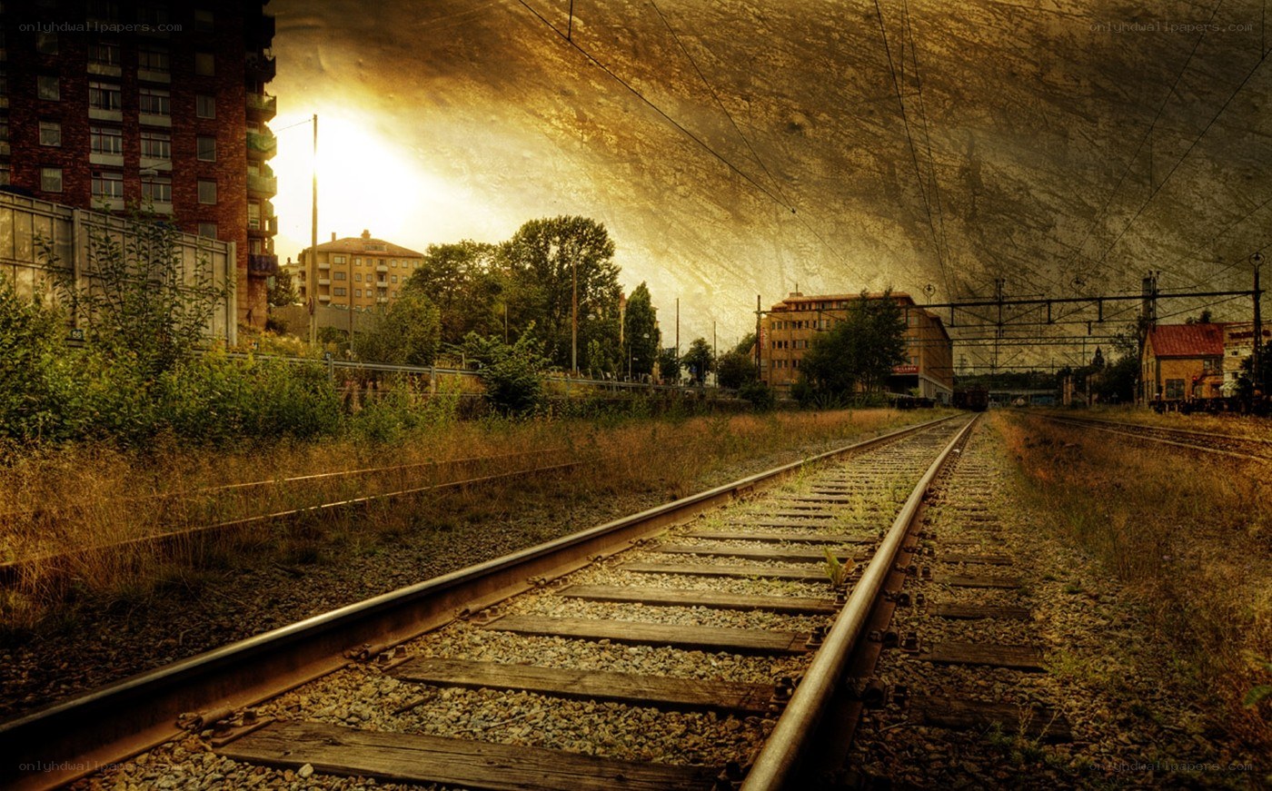 abandoned train tracks at sunset