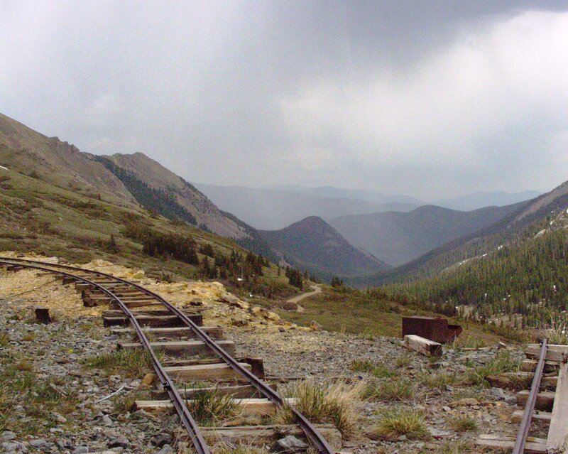 abandoned train tracks in mountain valley