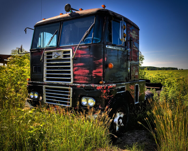 abandoned truck in a field