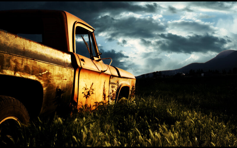 abandoned truck in field