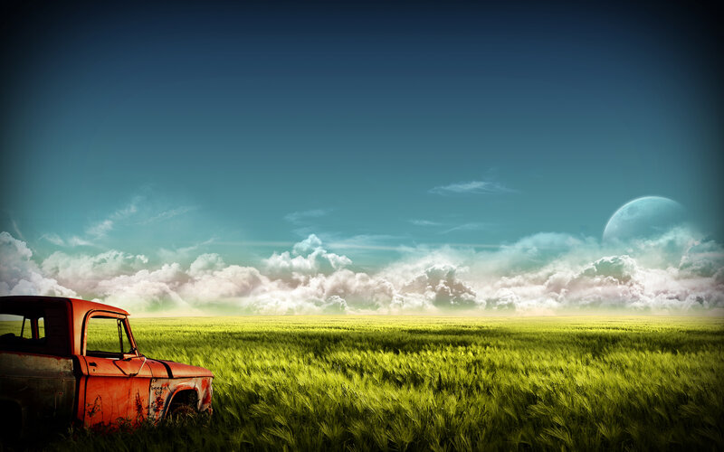 Abandoned truck in green field