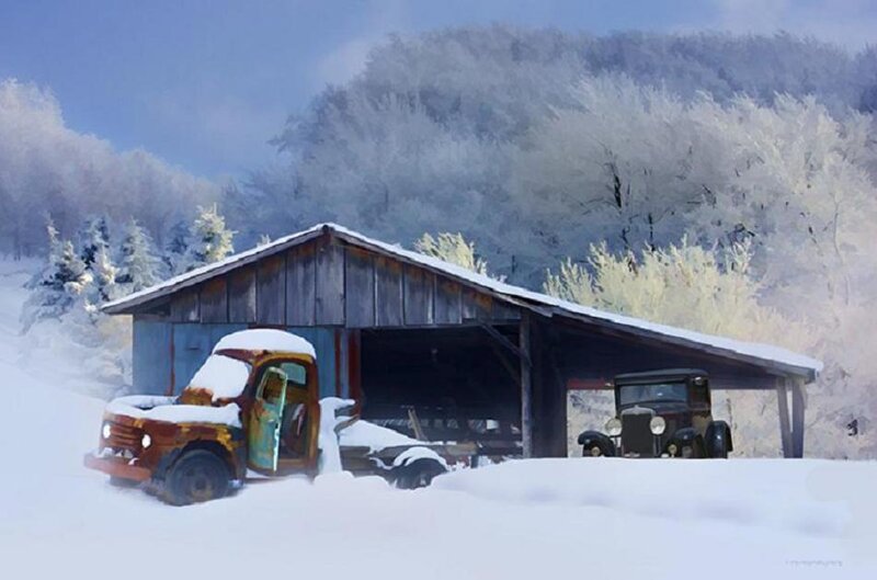 Abandoned trucks in snowy landscape