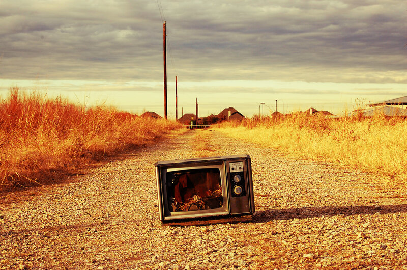 Abandoned TV on a Gravel Road