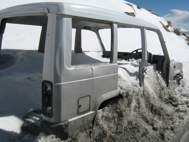 Abandoned vehicle in snow