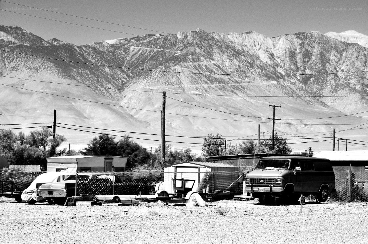 Abandoned vehicles in desert valley