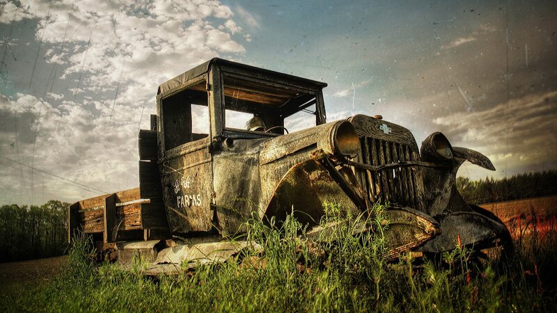 abandoned vintage truck in field