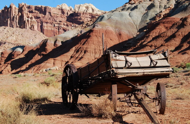 Abandoned wagon in desert canyon