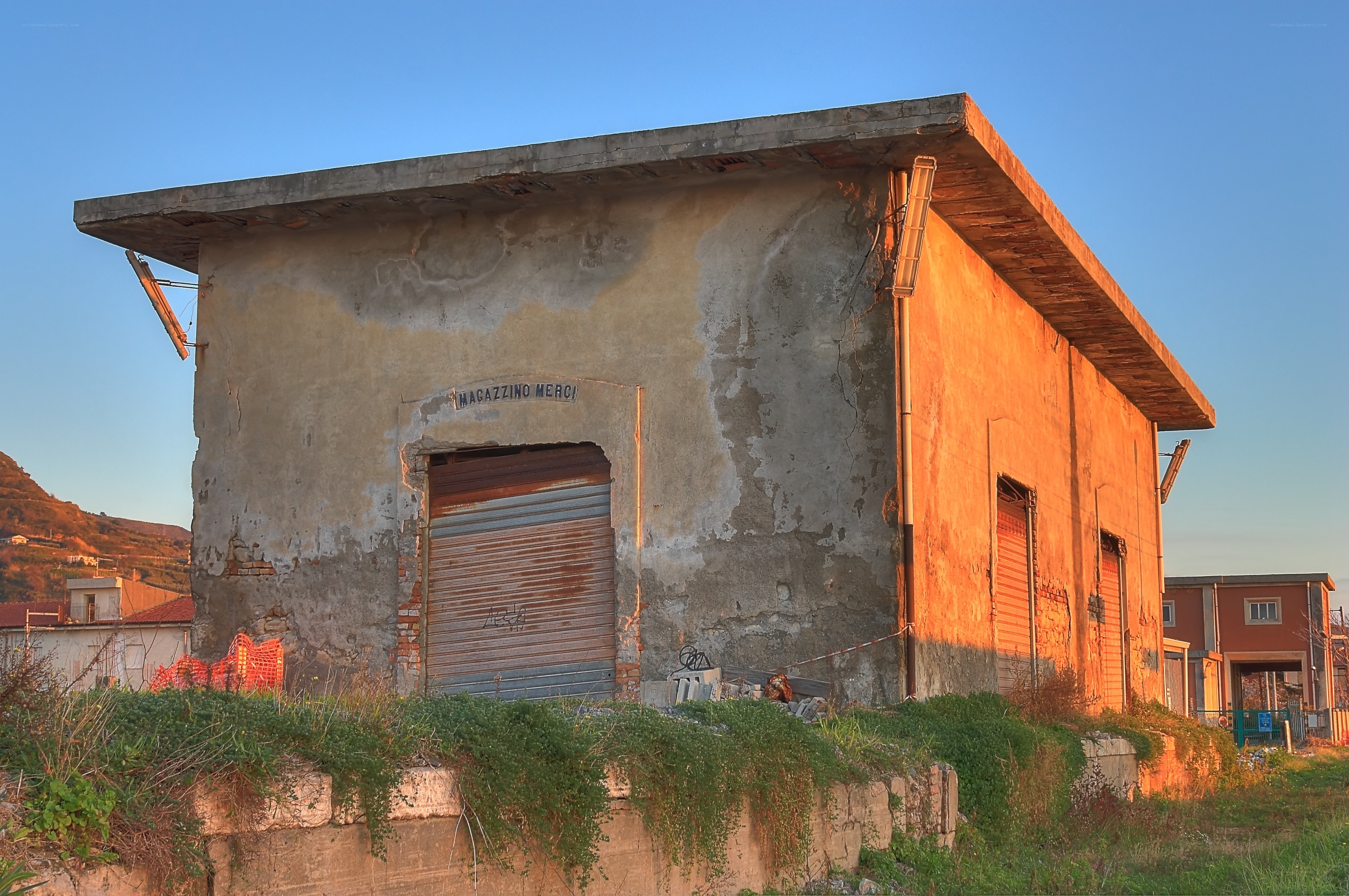 Abandoned warehouse at sunset