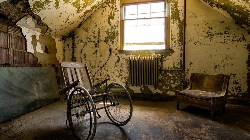 Abandoned Wheelchair in Room