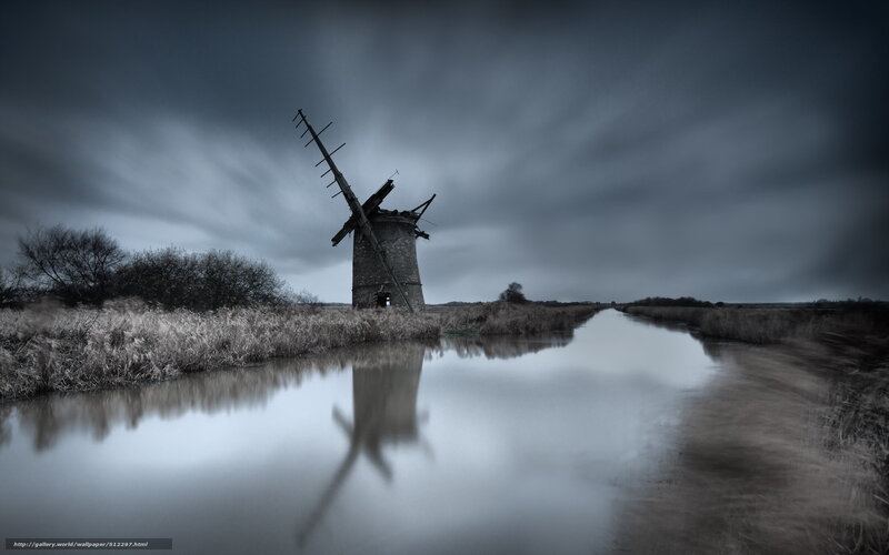 Abandoned windmill by canal