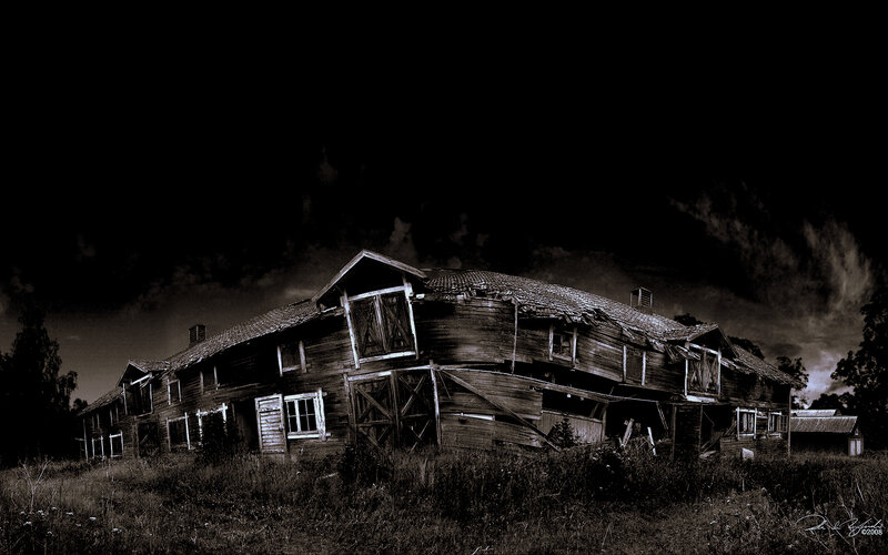 abandoned wooden house at night