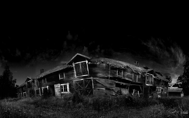 Abandoned wooden house at night