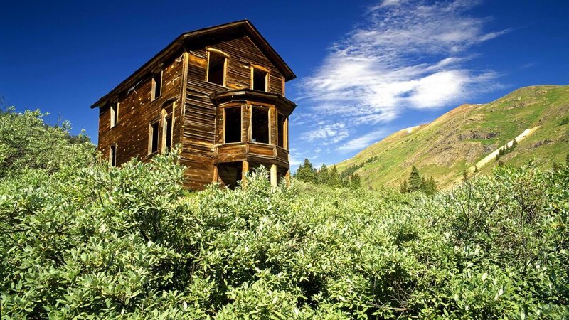 Abandoned wooden house in mountains
