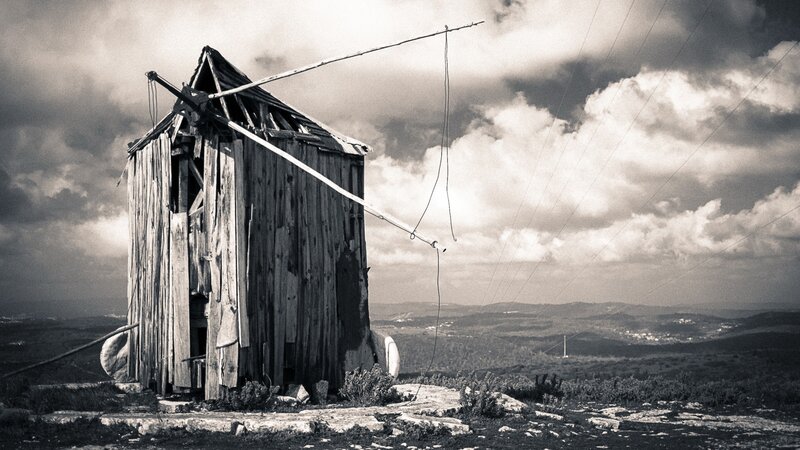 Abandoned wooden hut on hilltop