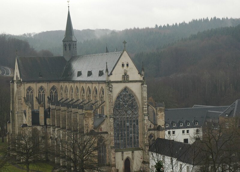 abbey in a forested valley