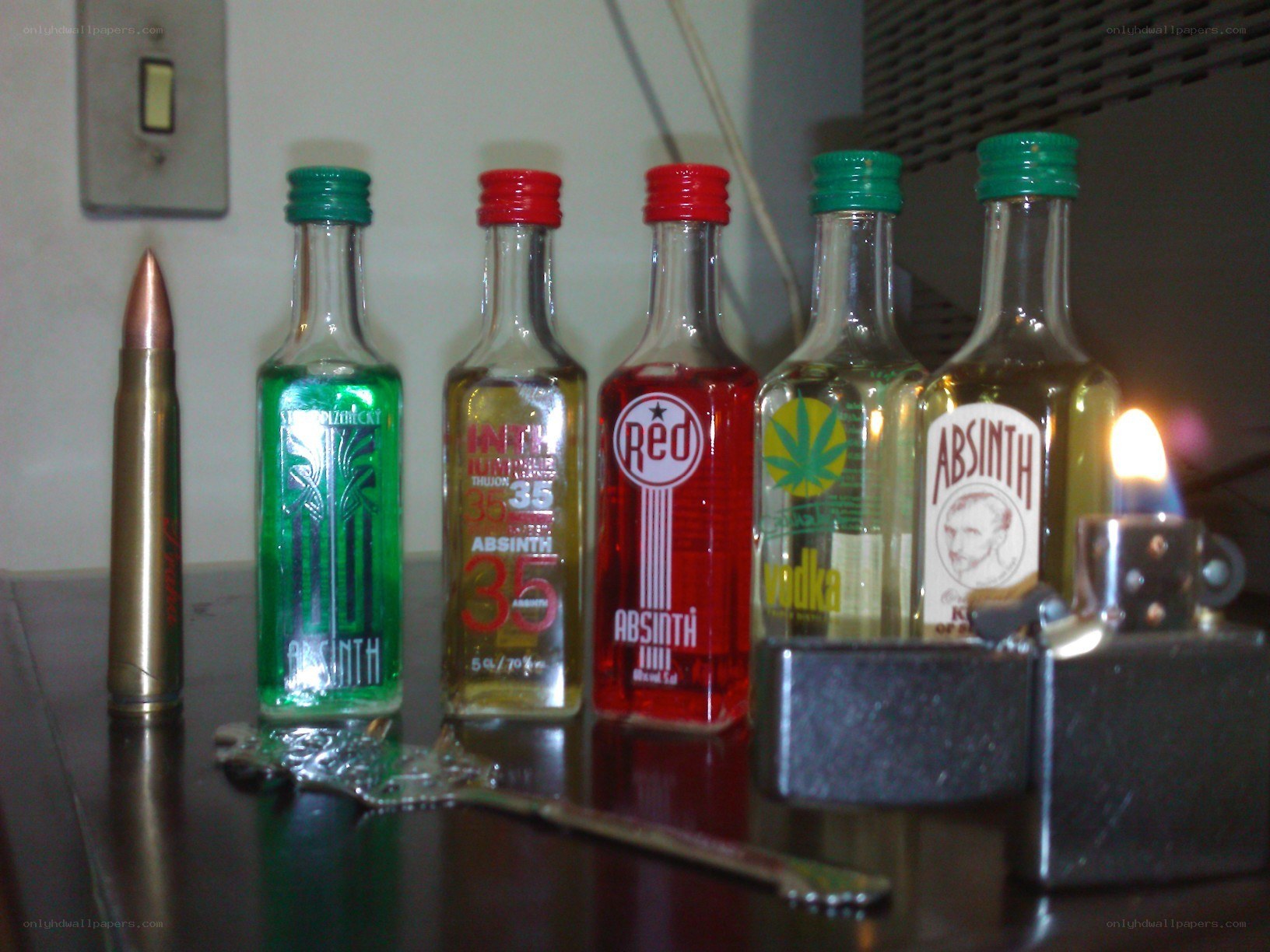 Absinthe bottles and a bullet