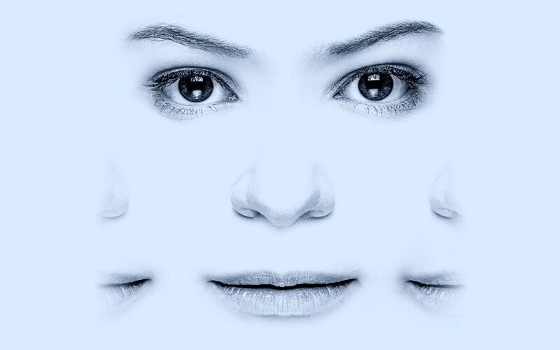 abstract face with multiple eyes