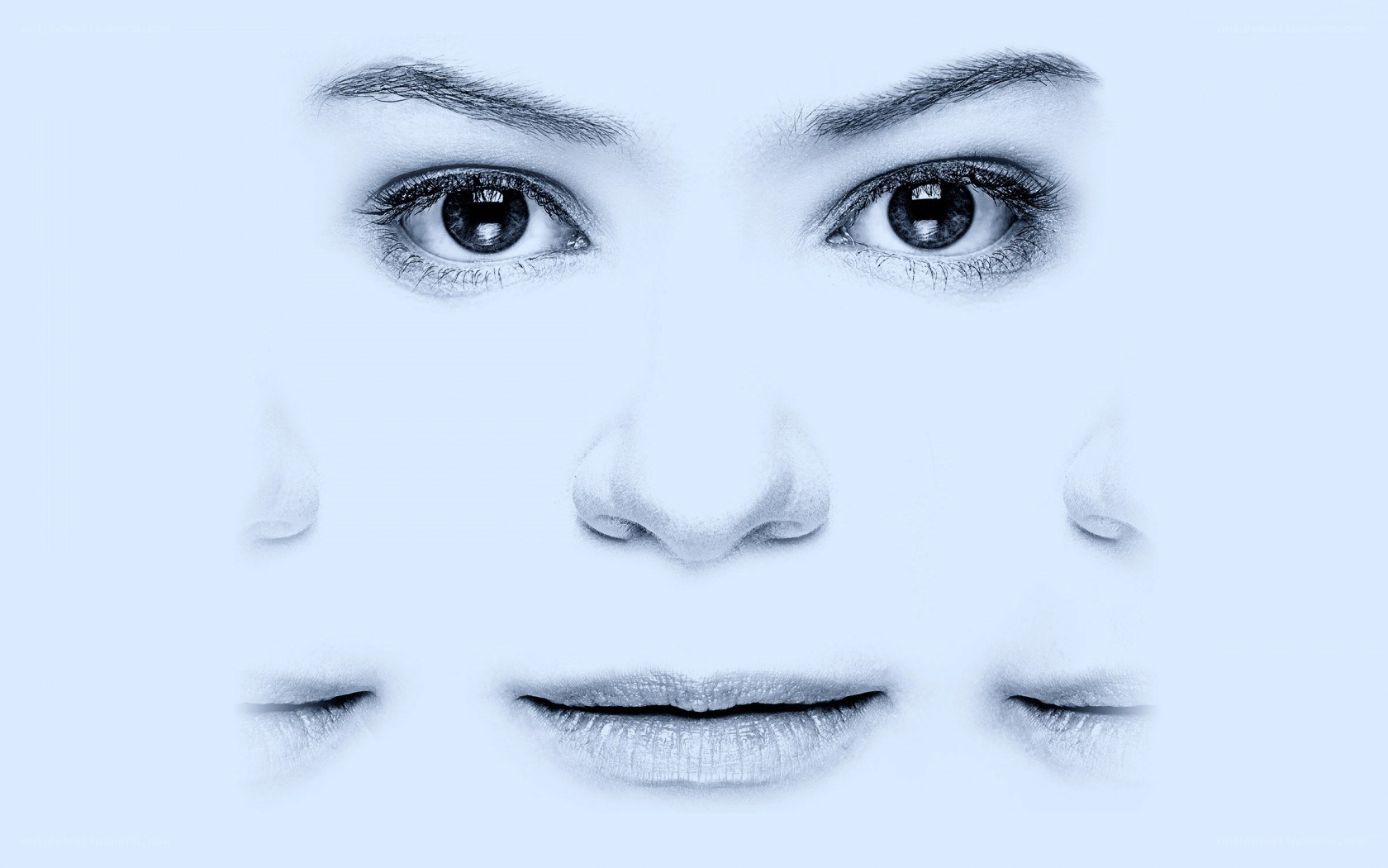 abstract face with multiple eyes