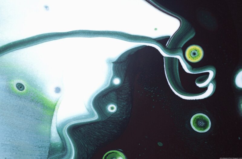 Abstract fluid art with green and white swirls