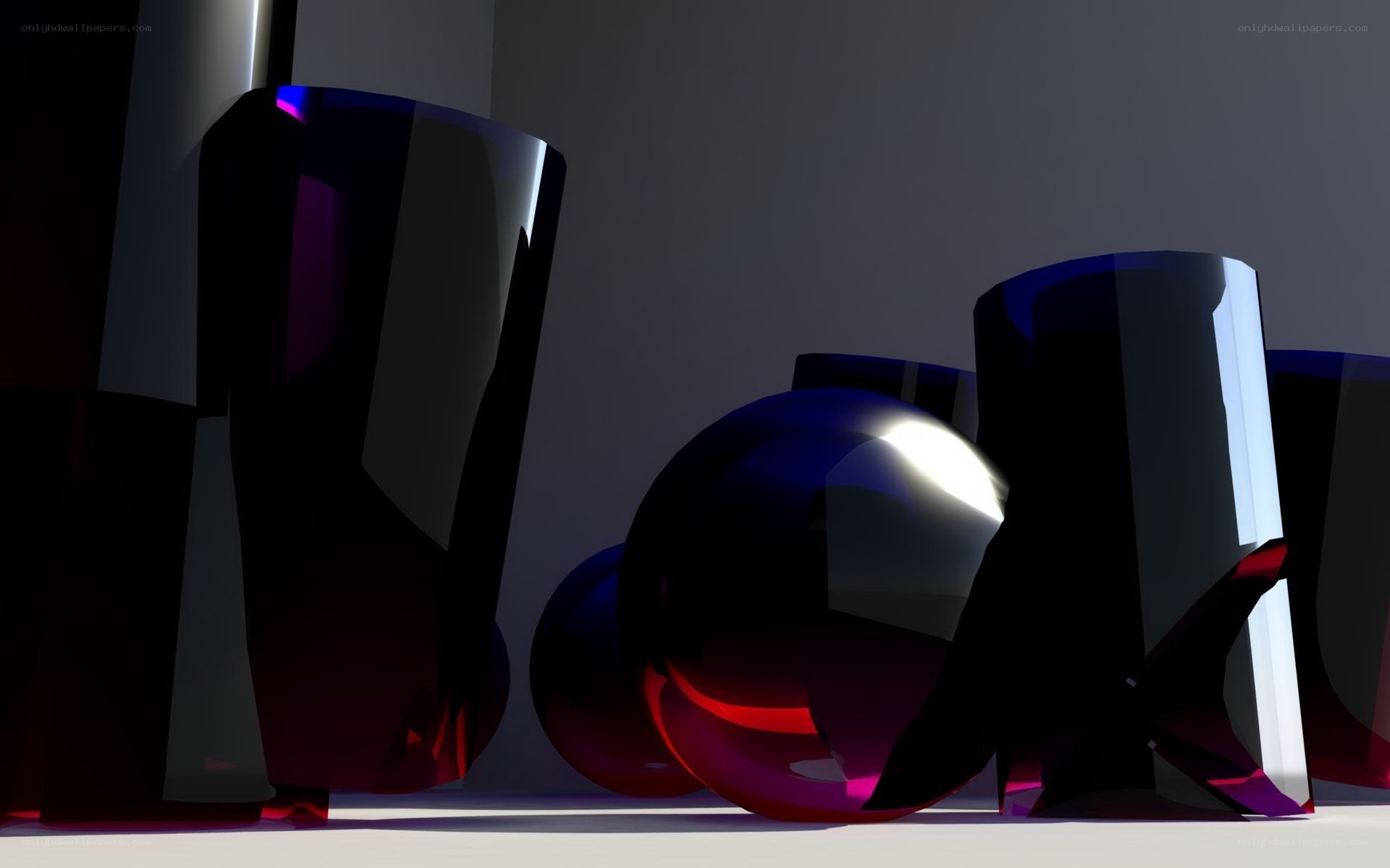 Abstract glass shapes in dark setting
