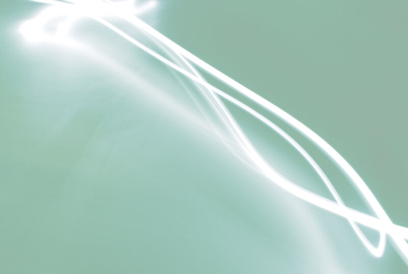 Abstract light streaks on green