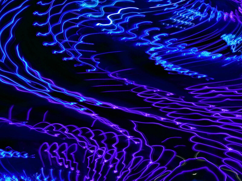 Abstract light trails in blue and purple