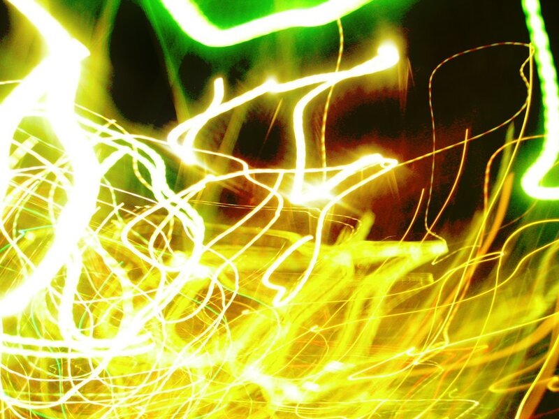 Abstract light trails in yellow and green
